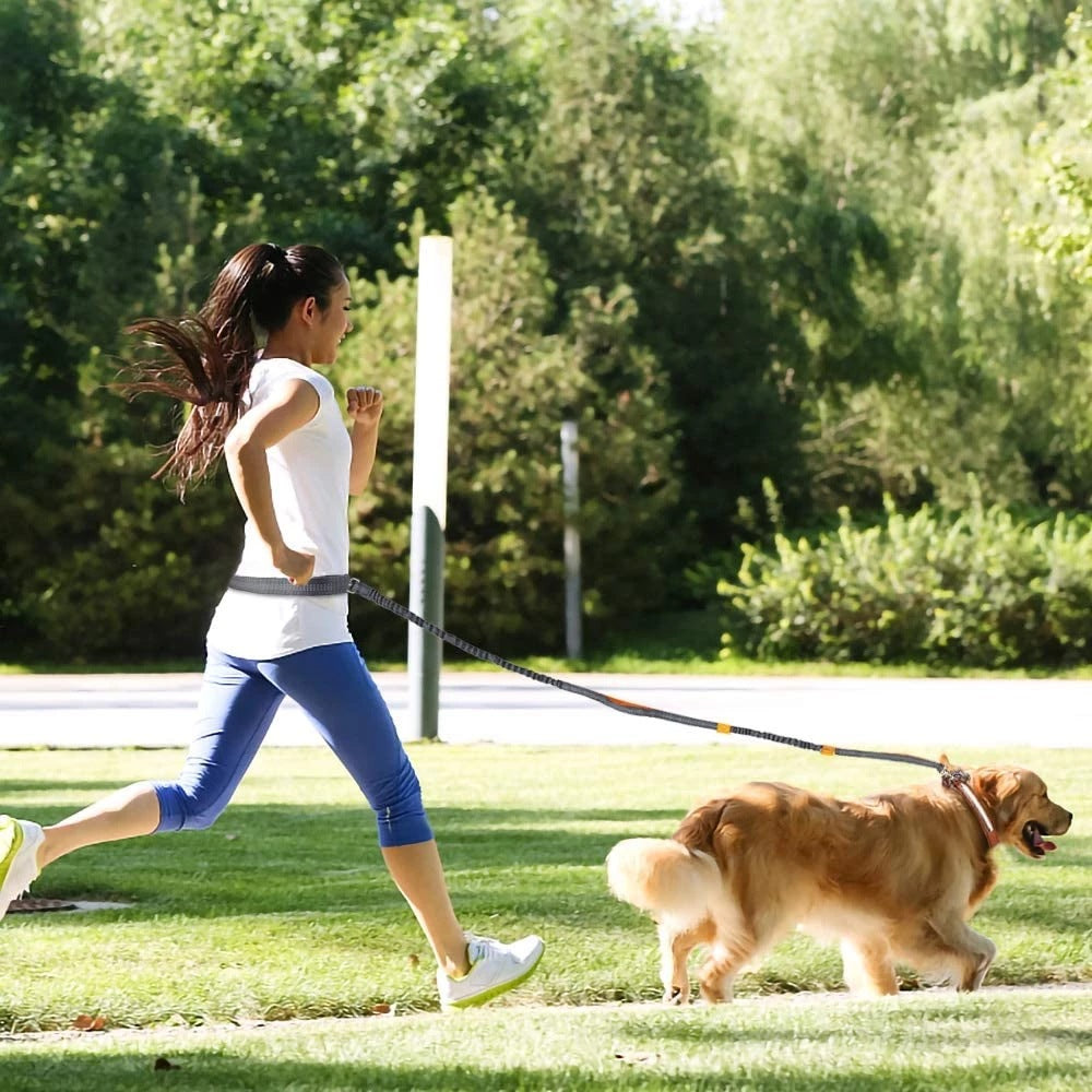 Woman walking her dog using the PawRun™ hands-free waist leash